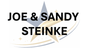 Logo of St. Joan of Arc Catholic School featuring a star and the names Joe & Sandy Steinke, representing the school's community and values.